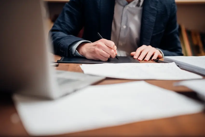 Car accident victim reviewing a partial fault insurance claim and settlement offer